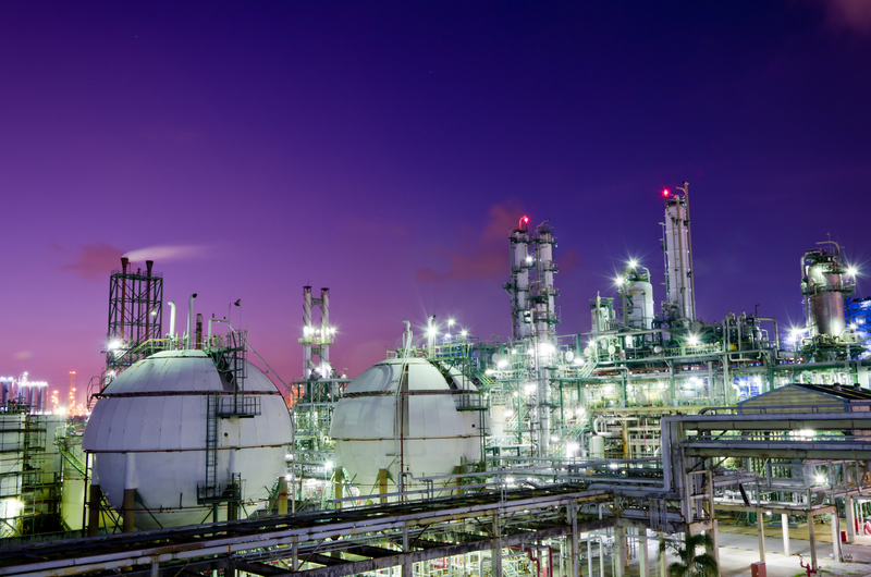 Gas storage spheres tank in petrochemical plant at night